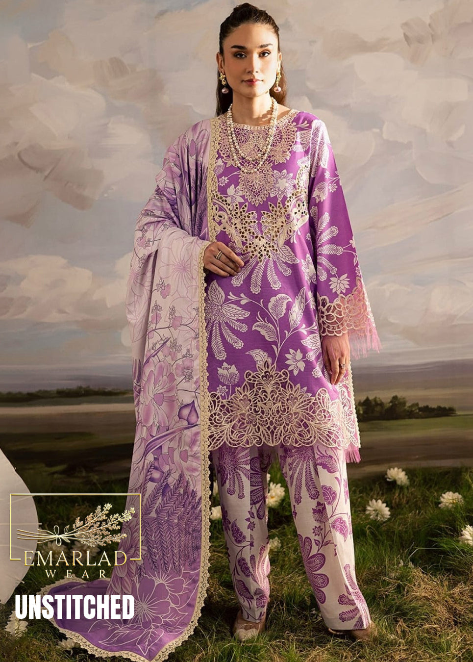 Woman wearing a purple and white embroidered outfit with a scenic background