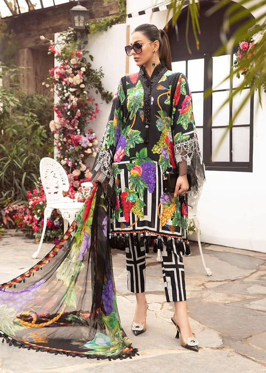 Woman in a colorful outfit with a floral pattern standing in an outdoor setting.